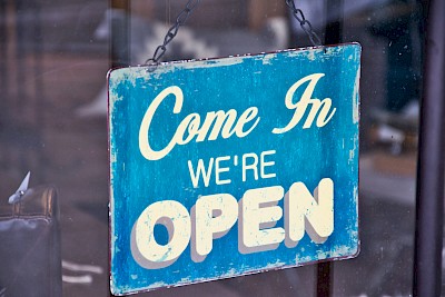 https://www.pexels.com/photo/blue-and-white-come-in-we-re-open-signboard-1376412/